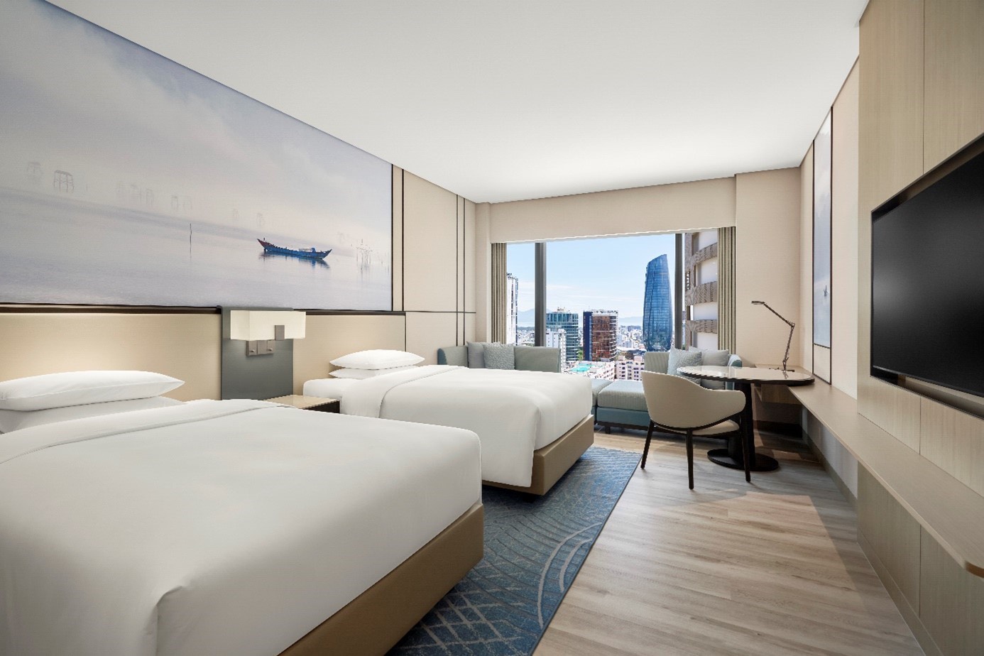 Phòng nghỉ rộng rãi, tiện nghi, đáp ứng tiêu chuẩn lưu trú chuyên nghiệp cho khách MICE tại trung tâm thành phố Đà Nẵng.